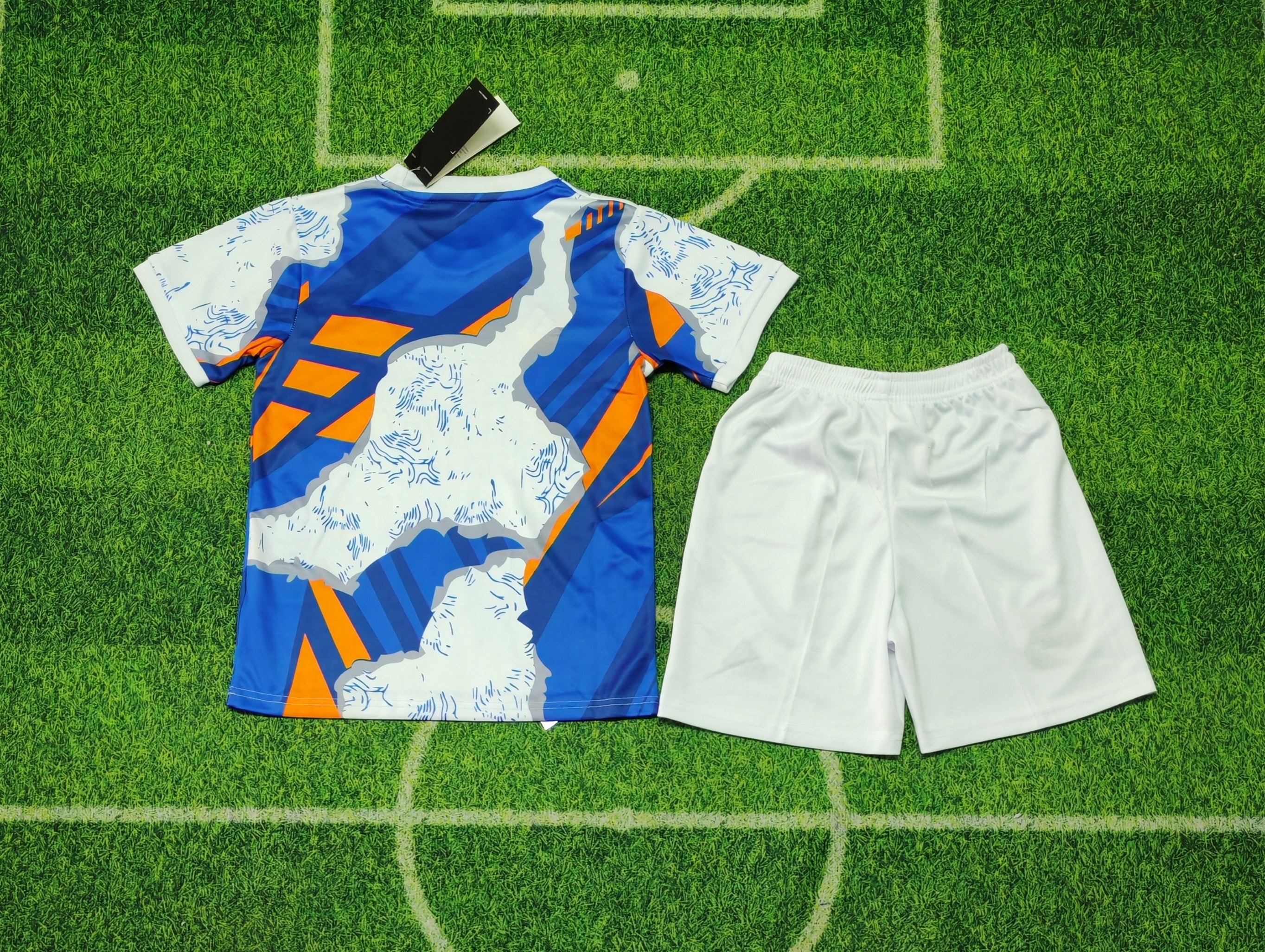 Real Madrid 25/26 Special Edition Kit Kids – Blue Orange Graphic